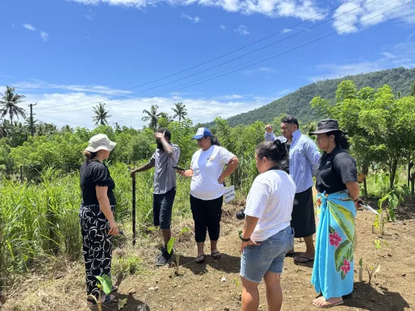 Students gathered beside a field.
