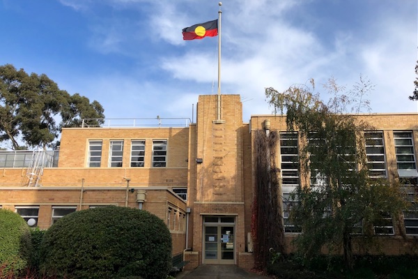 The Aboriginal flag above the Burnley building