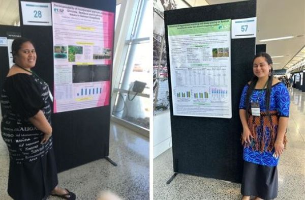 Two women in front of their posters.
