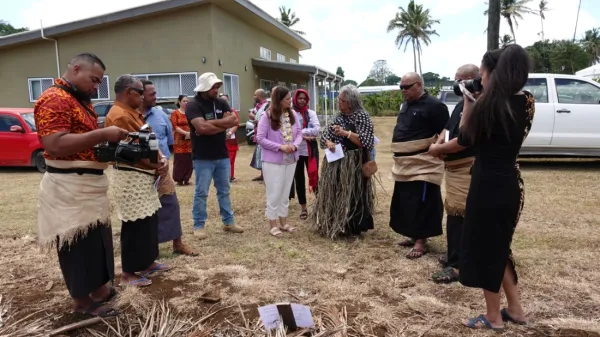 People gathered next to the field day in Tonga.